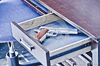 1911 handgun in drawer Stock Photo