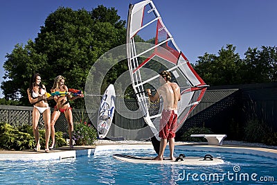 2 girl a guy and a pool Stock Photo