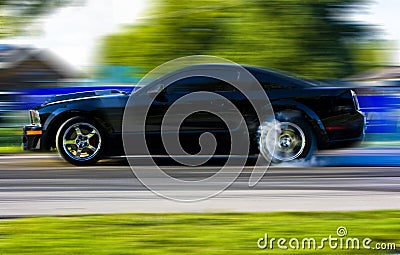 2009 Ford Mustang Race Car in Motion Stock Photo