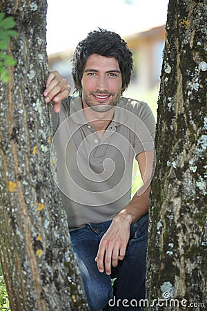 25 years old man crouching Stock Photo