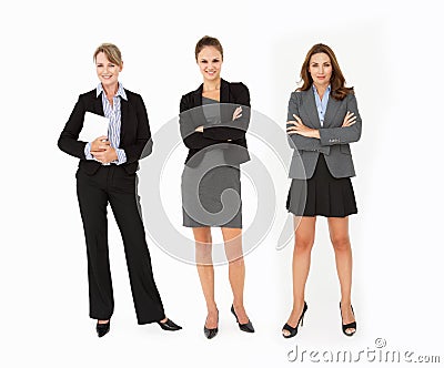 3 Business women standing in studio Stock Photo