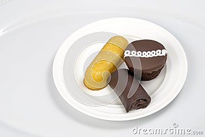 3 different kind of snack cakes on a plate Stock Photo