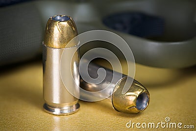 .45 Caliber Hollow Pistol Bullets Near Handgun Stock Photo