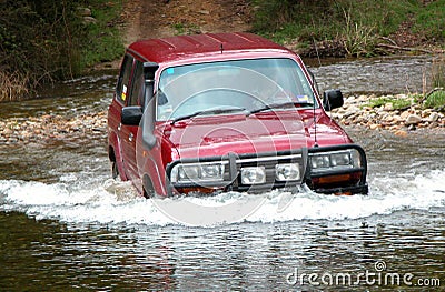 4WD Crossing River Stock Photo