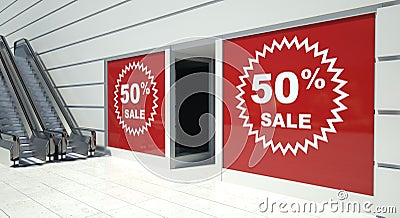 50 percent sale on shopfront windows and escalator Stock Photo