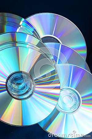 7149 Shiny glowing compact disks on black Stock Photo
