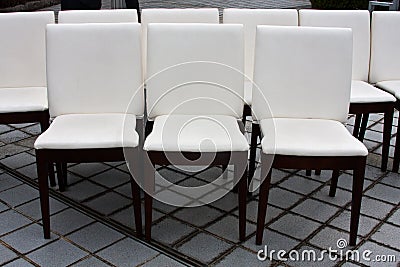 9 white chairs Stock Photo