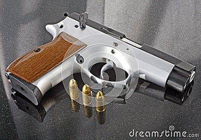 9mm handgun with bullets Stock Photo