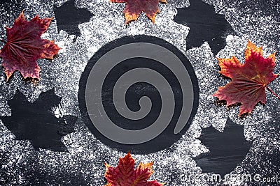 AAbstract autumn background. Sprinkle wheat flour circle, round spot on black. Top view on blackboard. Baking concept and menu for Stock Photo