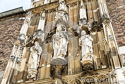 Aachen/ Germany: The facade of a Gothic Church with Statues Editorial Stock Photo
