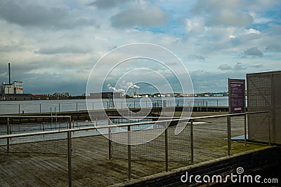 Aalborg, Denmark: Beautiful view from the waterfront to the river and factories. Aalborg Stock Photo