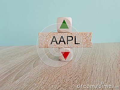 AAPL price symbol. A brick block with arrow symbolizing that AAPL index price are going down or up. Editorial Stock Photo