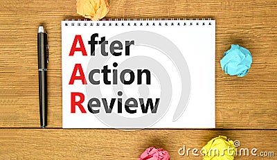AAR After action review symbol. Concept words AAR After action review on beautiful white note. Beautiful wooden table wooden Stock Photo