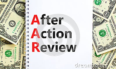 AAR After action review symbol. Concept words AAR After action review on beautiful white note. Dollar bills. Beautiful dollar Stock Photo