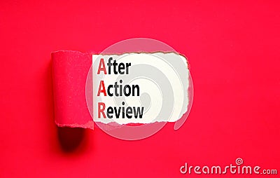 AAR After action review symbol. Concept words AAR After action review on beautiful white paper. Beautiful red paper background. Stock Photo