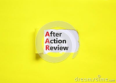 AAR After action review symbol. Concept words AAR After action review on beautiful white paper. Beautiful yellow paper background Stock Photo