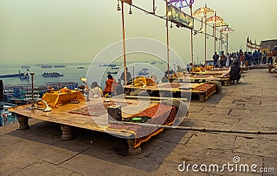 Aarti ceremony Ganga Ghat people at holy ghats among ancient hindu temples in early morning in Varanasi Evening at Banaras Ghat Editorial Stock Photo