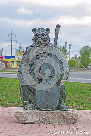 Abakan, Russia 05/02/2020: Bronze monument, Bear with double bass and musical notes Editorial Stock Photo