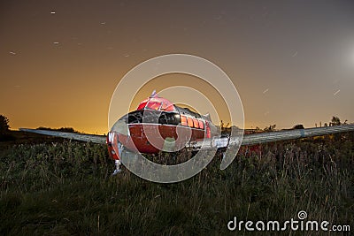 Abandoned airplane at night Stock Photo