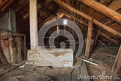 Abandoned attic of a residential building. The structure is 50 years old. Attic heaven. Stock Photo