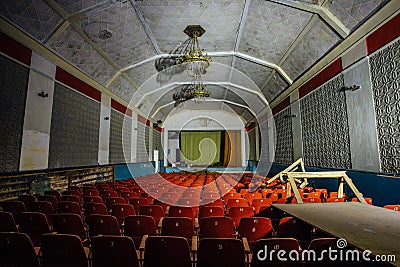 Abandoned auditorium in old soviet palace of culture Stock Photo