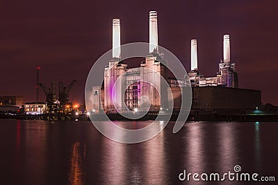 Abandoned Battersea power station at night Stock Photo