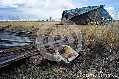 Abandoned and broken down farm house in the Alberta prairies Stock Photo