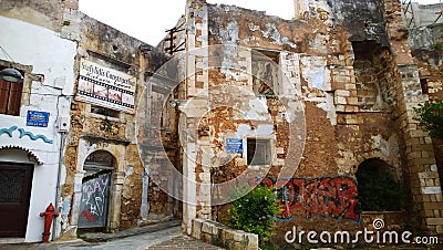 An abandoned building in the center of Chania with modern graffiti on it Editorial Stock Photo