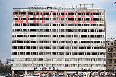 Abandoned building facade with graffiti slogan - stop wars Editorial Stock Photo