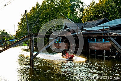 Abandoned Canal Village and Longtail Boat Riding Editorial Stock Photo