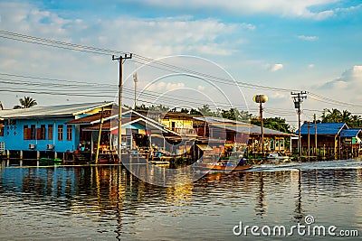 Abandoned Canal Village and Longtail Boat Riding Editorial Stock Photo