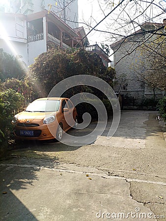 Abandoned car and a kitten by the door of the villa Editorial Stock Photo
