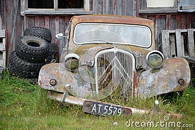 abandoned car next to old barn Editorial Stock Photo