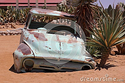 Abandoned classic car stuck desert sand, Namibia Stock Photo