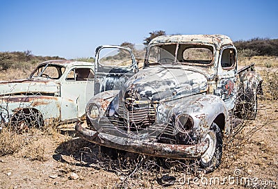 Abandoned classic cars rusting in Namib desert, Namibia Stock Photo