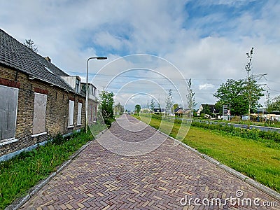 Abandoned and closed demolition buildings along the Hoofdweg in Nieuwerkerk Editorial Stock Photo