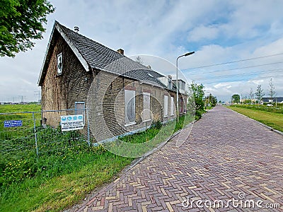 Abandoned and closed demolition buildings along the Hoofdweg in Nieuwerkerk Editorial Stock Photo