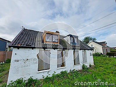 Abandoned and closed demolition buildings along the Hoofdweg in Nieuwerkerk Editorial Stock Photo