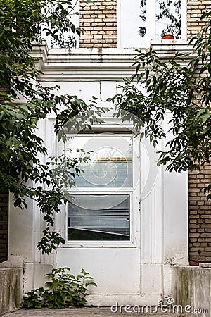 Abandoned closed door of house with glass panels Stock Photo