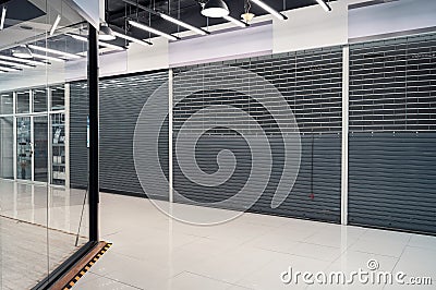 Abandoned closed shutter shop in department store Stock Photo