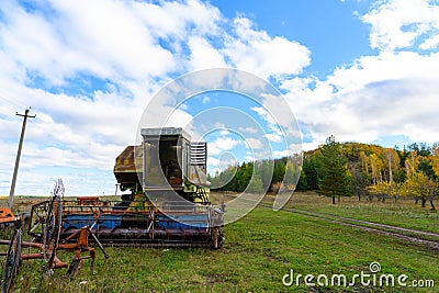 Abandoned combine harvester. Rusty spoiled combine harvester. Stock Photo