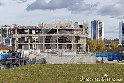 Abandoned construction of a large concrete building. Stopped construction of an office building due to lack of funding Stock Photo