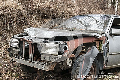 Abandoned crashed broken car Stock Photo