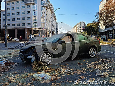 Abandoned, damaged car in a street. Insurance concept. Stock Photo