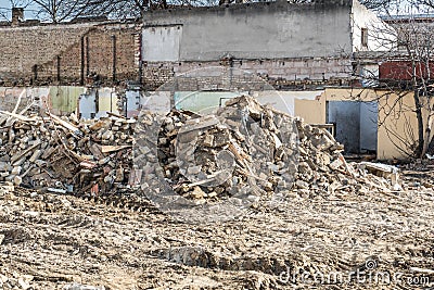 Remains of hurricane or earthquake aftermath disaster damage on ruined old houses with collapsed roof and wall Stock Photo