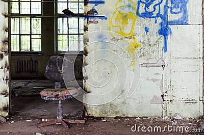 Abandoned and dangerous production premise with trash on floor. Stock Photo