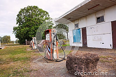 Abandoned derelict service station with petrol pumps Editorial Stock Photo