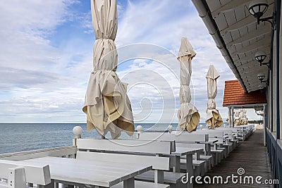 Abandoned deserted bar terrace tables. Stock Photo