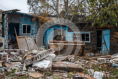 The abandoned and destroyed dwellings after accident. The household items left as a result of disaster Stock Photo