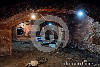 Abandoned empty old dark underground vaulted cellar Editorial Stock Photo